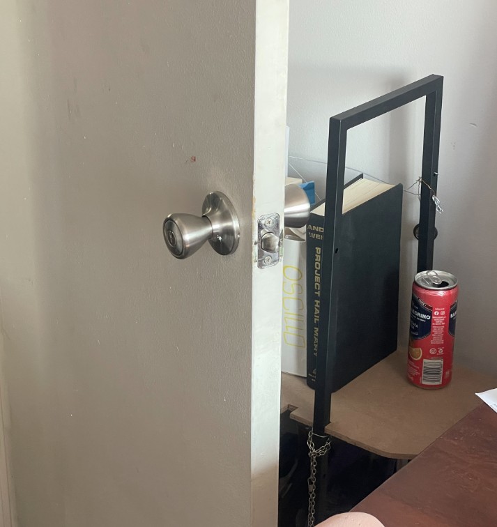 A shelf that fits neatly behind a door in a small room -- an image showing the shelf with the door open