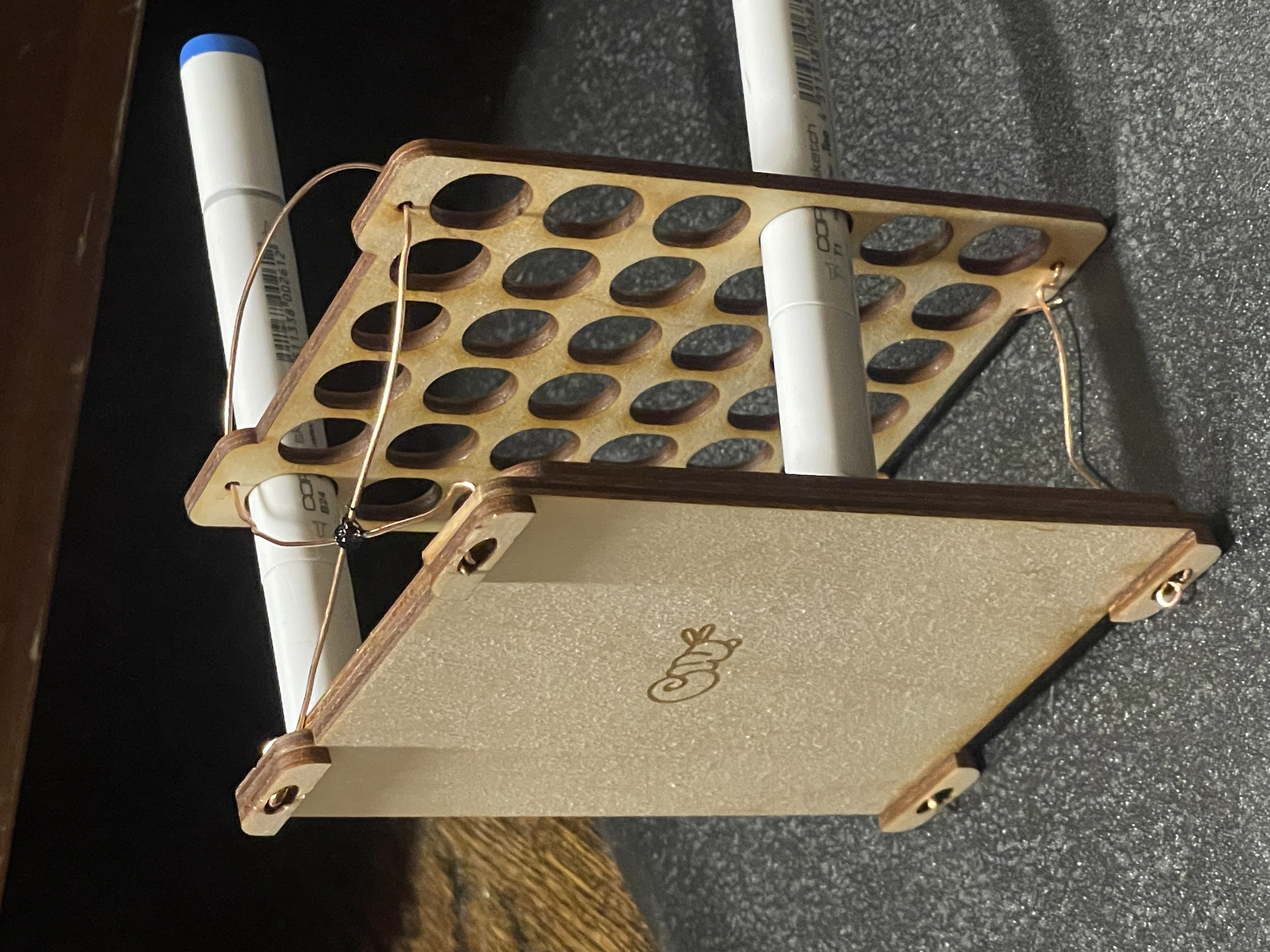 A small holder for copic markers, showing the bottom with hidden magnets